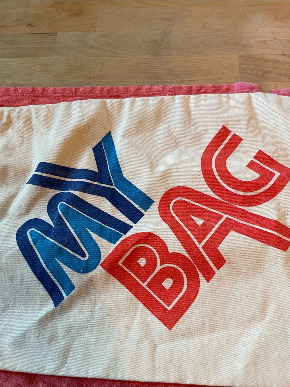 Vintage Canvas Tote with Bold Blue and Red 'MAY BAG' Print